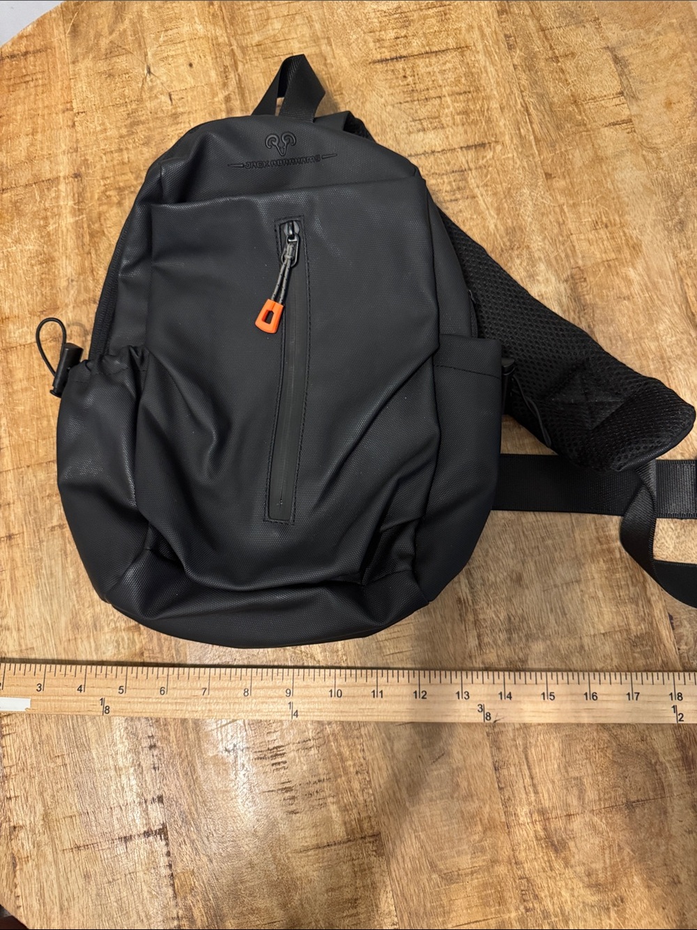 Jack Abrahams Black water resistant Sling Belt Bag with Orange Zip Accent